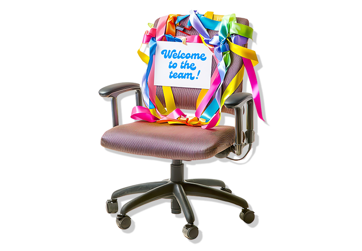 Office chair decorated with colorful streamers and a sign that says "Welcome to the team"