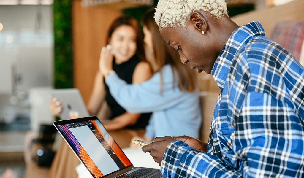young woman working on a computer doing ai training