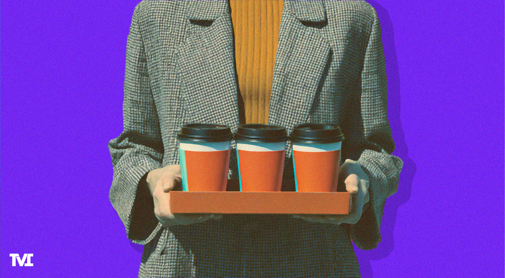 an intern visible from the shoulders down, carrying a tray of 3 coffees