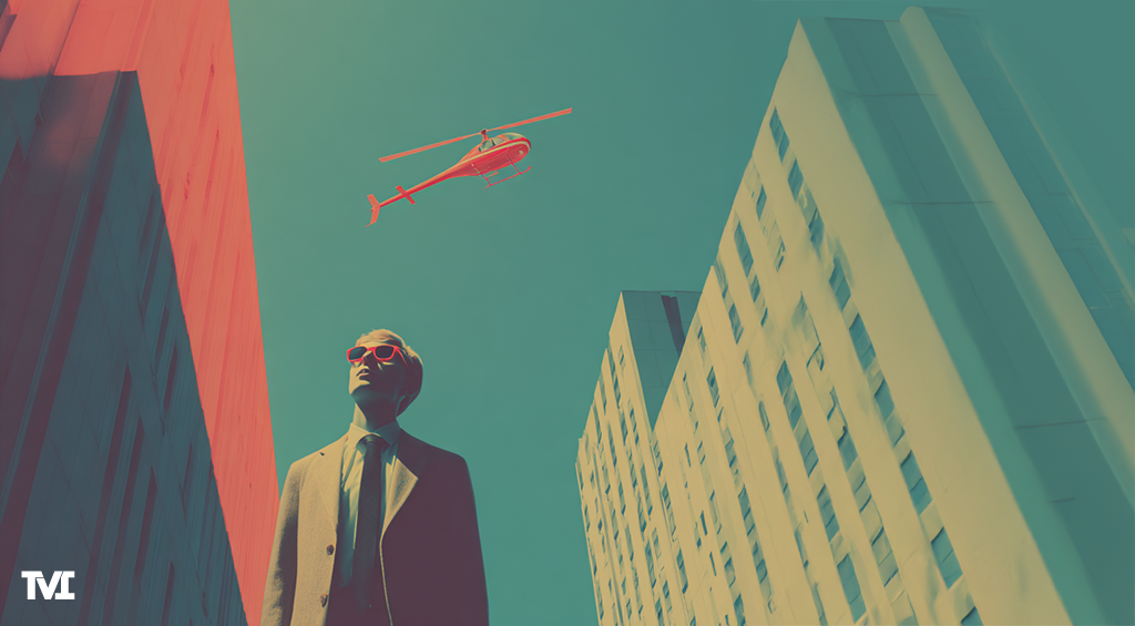 Young man walking in a city scape with a bright pink helicopter flying over head