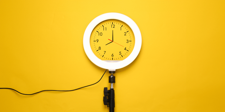 Ring light with a clock face on a bright yellow background