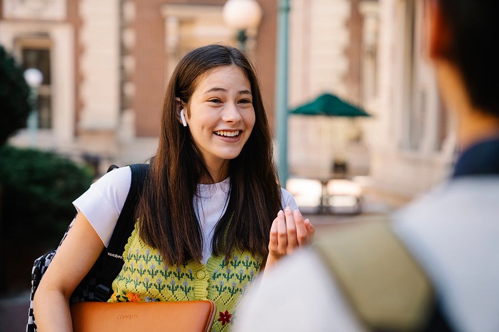 Young woman smiling and talking